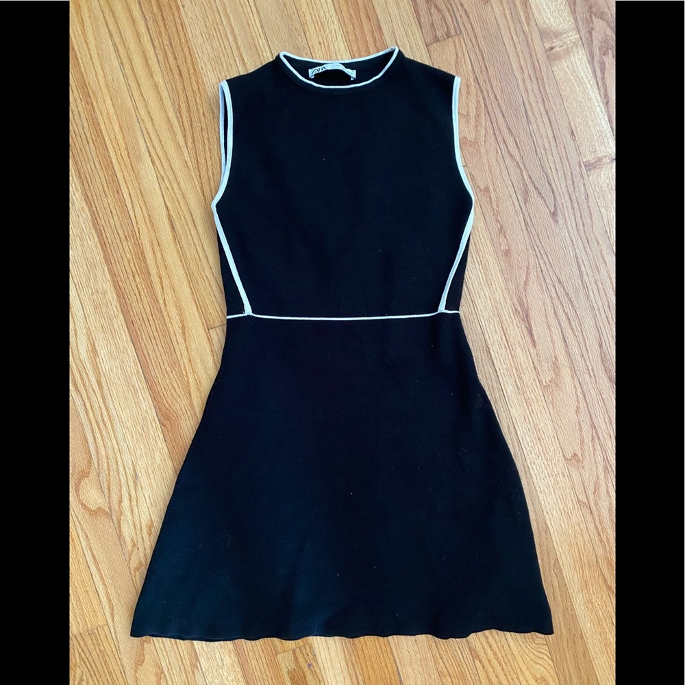 Classic little black dress!  Heavy quality fabric.  White trim makes it stunning